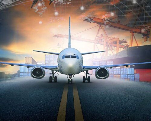 Cargo aircraft on the runway with containers behind it