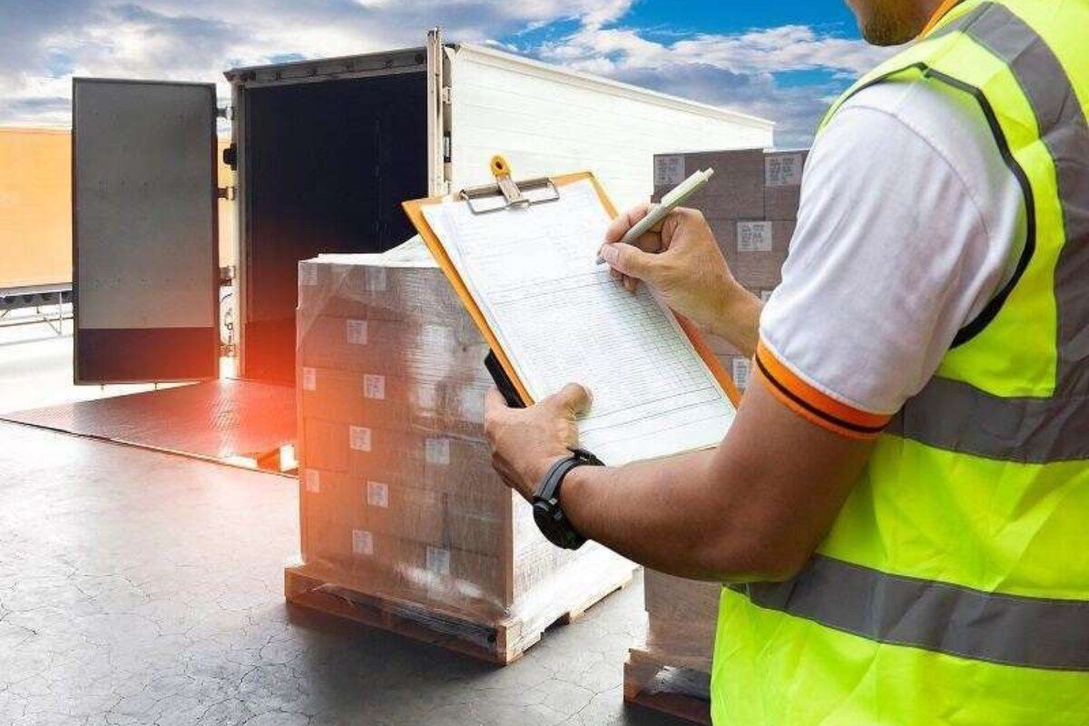 Warehouse worker checking cargo against a list